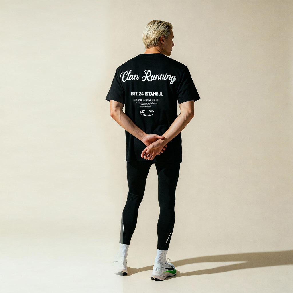 Clan Running black t-shirt - Lifestyle shot on runner
