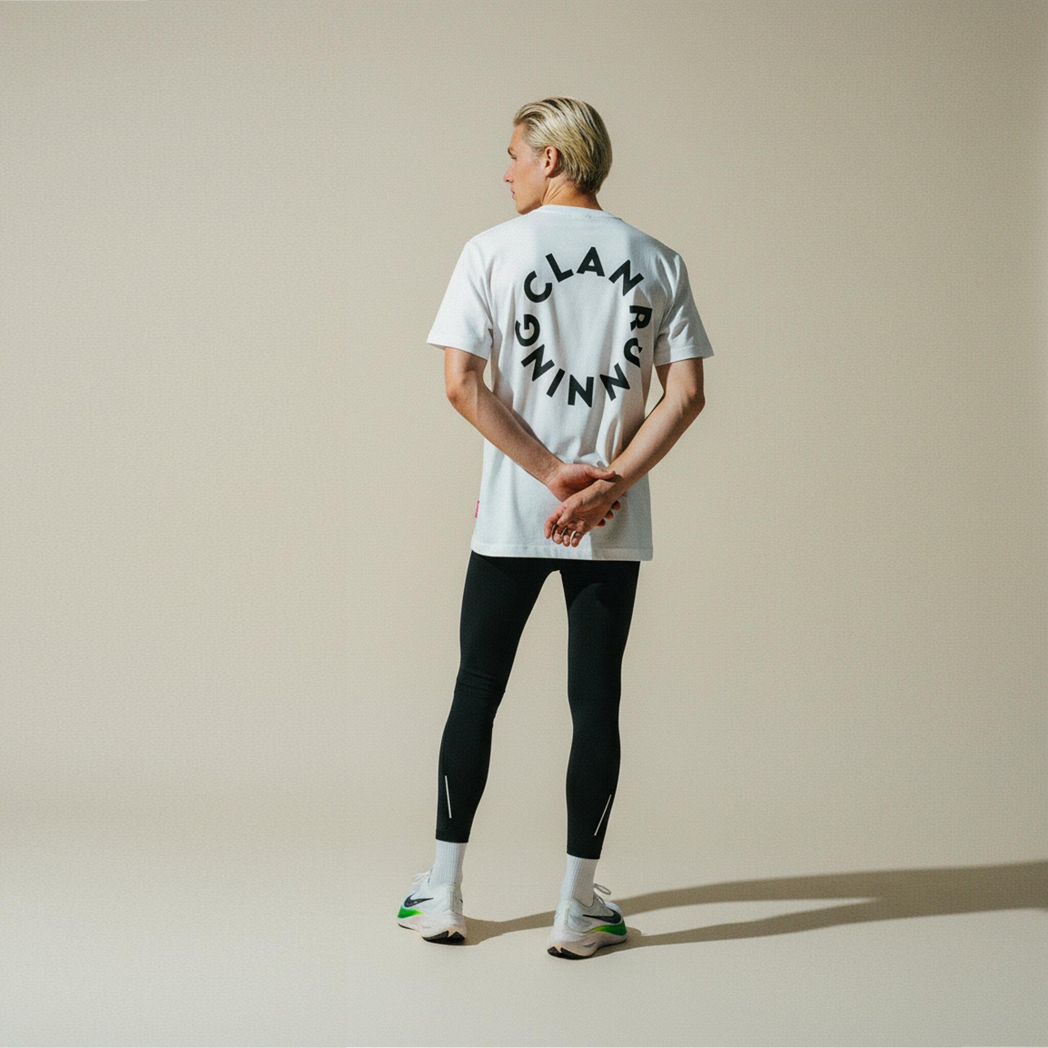 Clan Running white t-shirt - Lifestyle shot on runner
